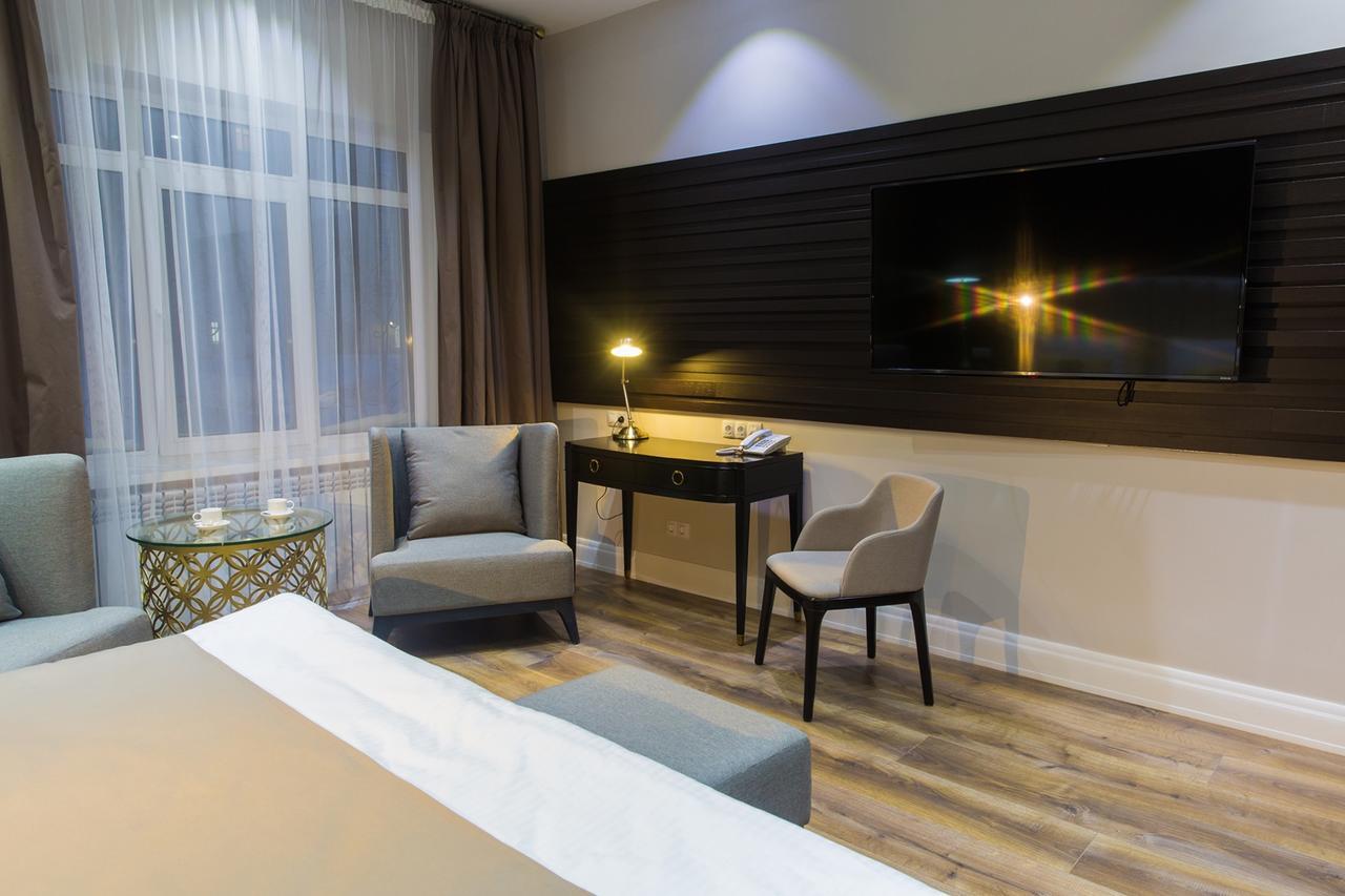 Qonaq Hotel Astana Bagian luar foto