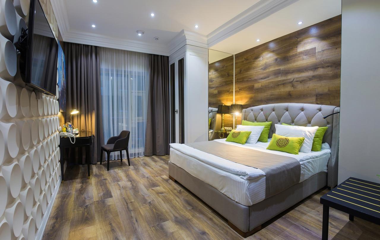 Qonaq Hotel Astana Bagian luar foto