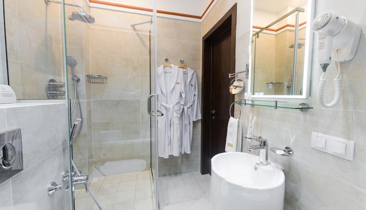 Qonaq Hotel Astana Bagian luar foto