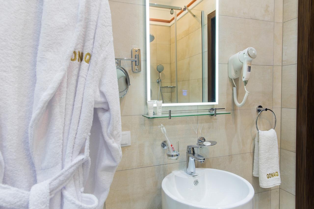 Qonaq Hotel Astana Bagian luar foto