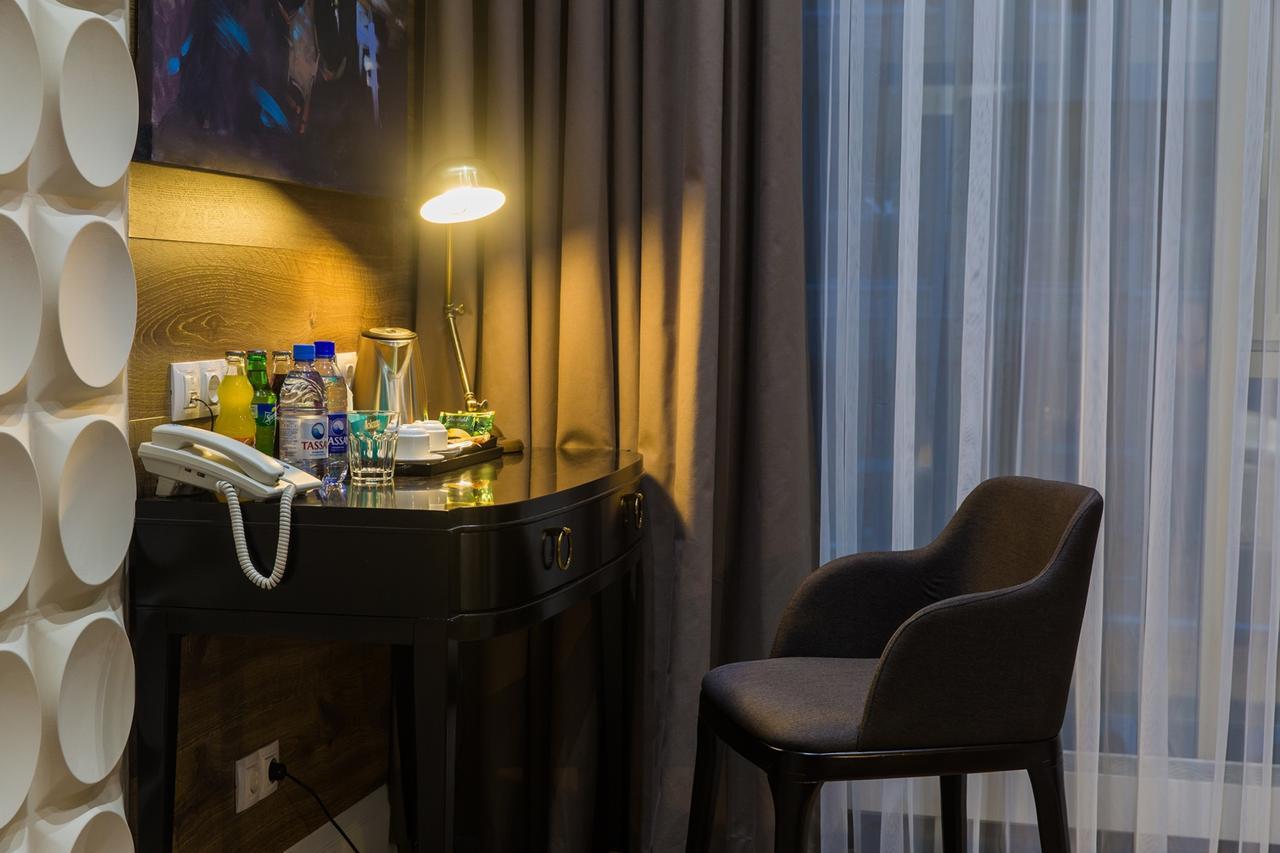 Qonaq Hotel Astana Bagian luar foto