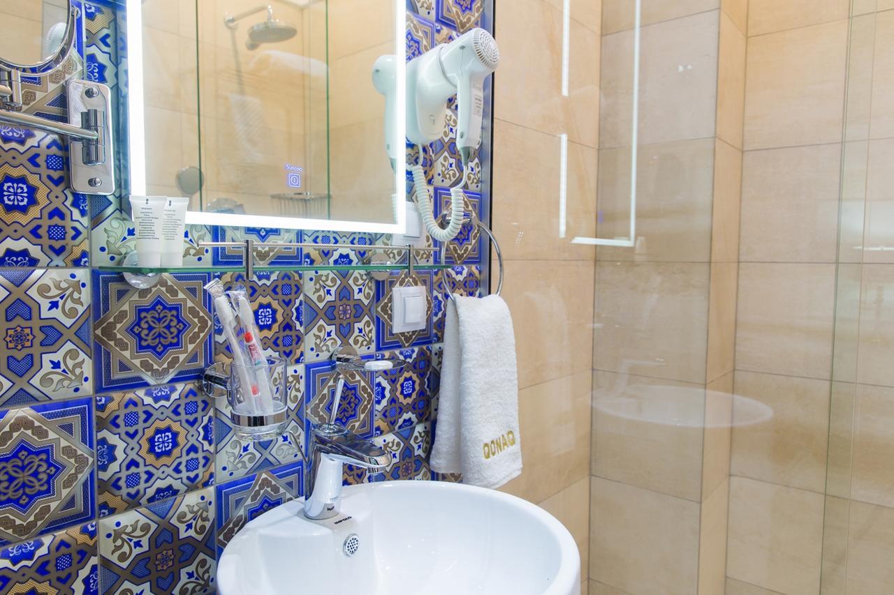 Qonaq Hotel Astana Bagian luar foto